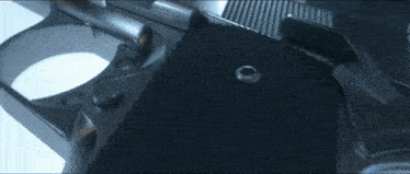 a close up of a gun 's grip with a ring on it