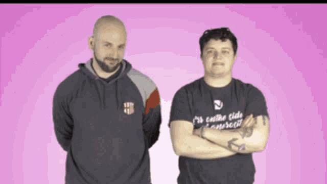 two men standing next to each other with one wearing a shirt that says ' i 'm on the side ' on it