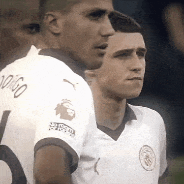 a group of soccer players are standing next to each other and one of them has the number 10 on his shirt