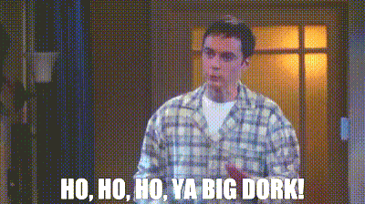 a man in a plaid shirt is standing in front of a door and says ho ho ho ya big dork !