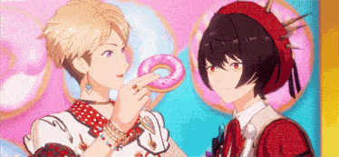 a couple of anime characters are standing next to each other and one of them is holding a donut .