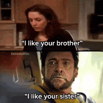 a man with a beard is talking to a woman in a kitchen .