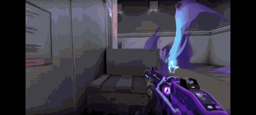 a purple gun is being held in a room