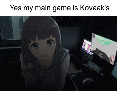 a girl is standing in front of a computer screen with the words yes my main game is kovaak 's