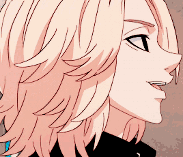 a close up of a person 's face with blonde hair and black eyes