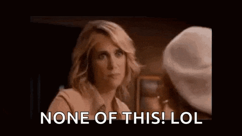 a woman is talking to another woman in a room and saying `` none of this ! lol '' .
