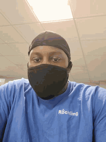 a person wearing a blue shirt that says richtling