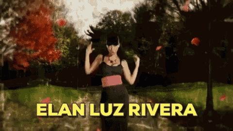 a woman dancing in a park with the name elan luz rivera