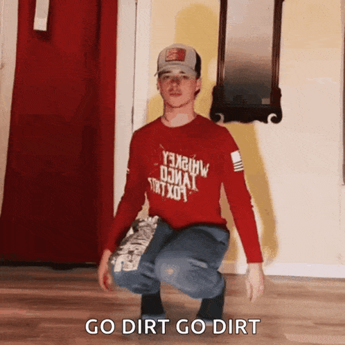 a man squatting down with the words go dirt go dirt written below him