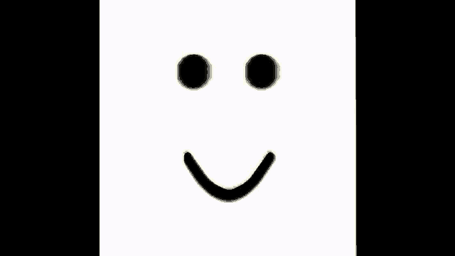 a white face with black eyes and a yellow smile