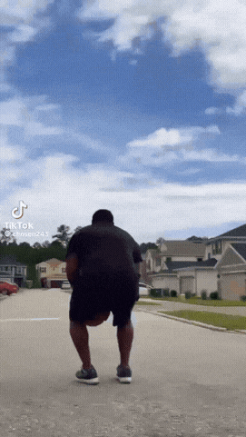 a tiktok video of a man holding a ball
