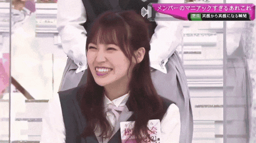 a woman with a name tag that says 21 on it smiles