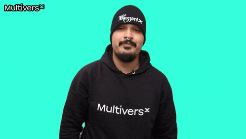 a man wearing a black beanie and a black sweatshirt with the word multivers on the bottom