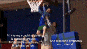 a basketball player is being lifted in the air by a coach who says i 'd say my coaching style
