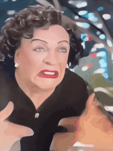 a woman with curly hair is making a funny face with her hands outstretched