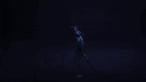 a blurred image of a person in a blue suit