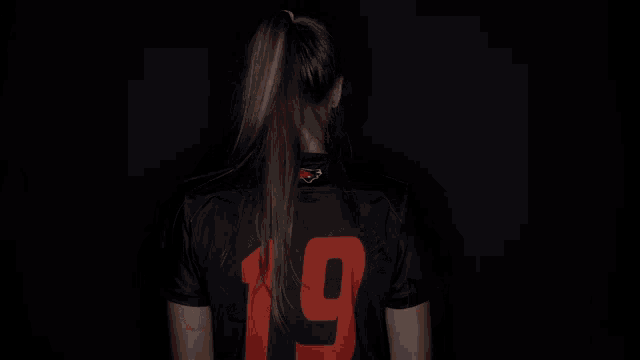 a woman wearing a black shirt that says campbell
