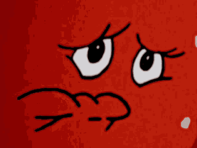 a close up of a cartoon face with an angry expression on it