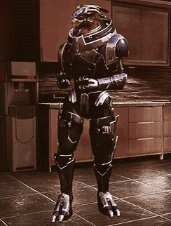 a man in a futuristic suit stands in a kitchen