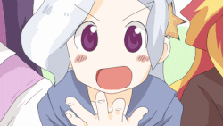 a little girl with white hair and purple eyes is making a funny face