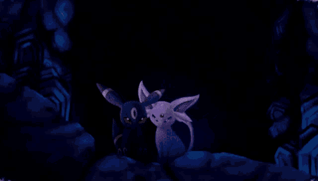 a black and purple cartoon cat standing next to each other