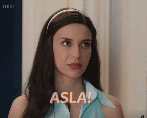 a woman in a blue shirt says " asla " in orange letters