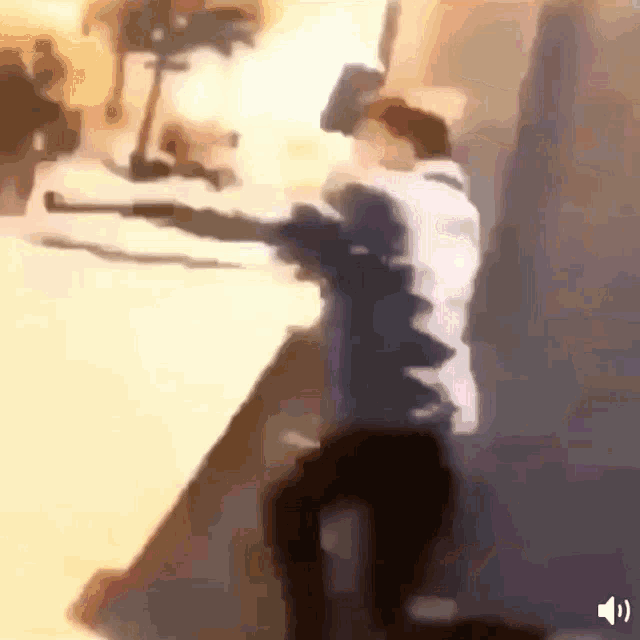 a blurry image of a person holding a gun