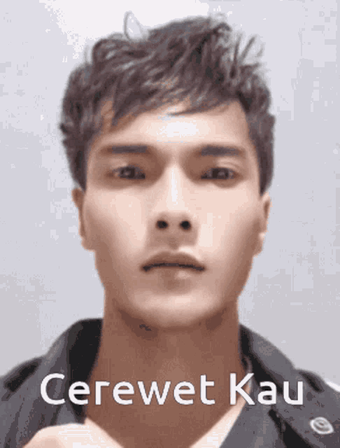 a close up of a man 's face with the words cerewet kau on the bottom