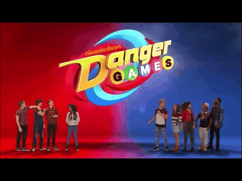 a group of young people standing next to each other in front of a danger games logo .