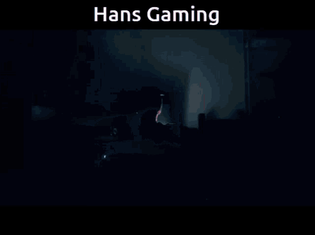 a dark room with a light coming out of a window and the words hans gaming above it