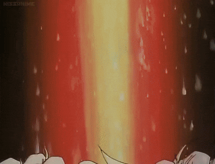 a person is standing in front of a red and yellow light coming out of the ground .
