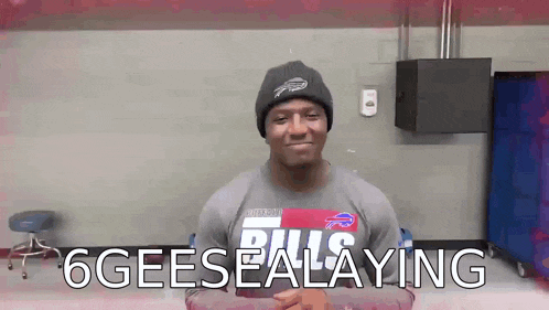 a man wearing a buffalo bills shirt and a beanie says 6geeseealing