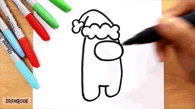 a person is drawing an among us character with a santa hat on