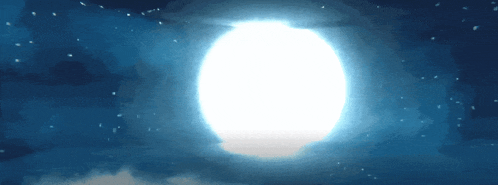a full moon in a dark blue sky
