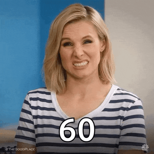a woman in a striped shirt is making a funny face with the number 60 written on her face .