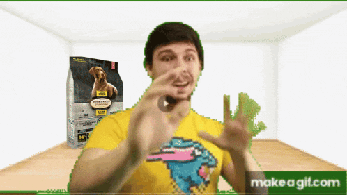 a man in a yellow shirt is holding a bag of dog food