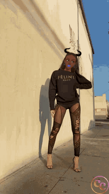 a woman wearing a feline meow sweatshirt