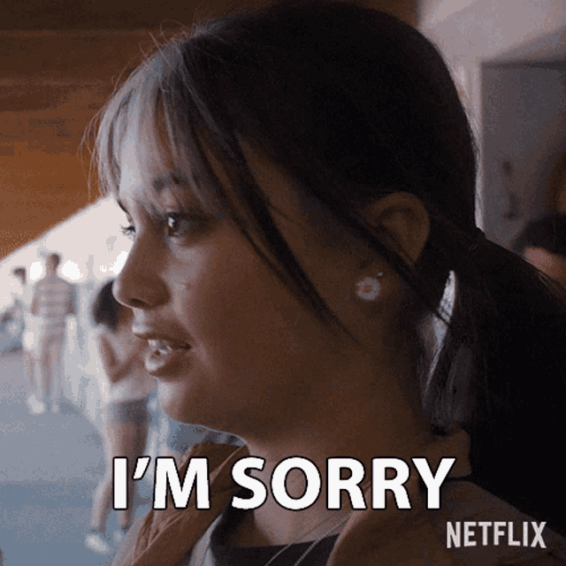 a woman says i 'm sorry with a netflix logo behind her