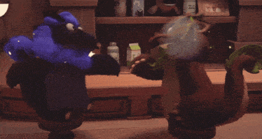 two stuffed animals standing next to each other in front of a shelf with bottles of milk in it