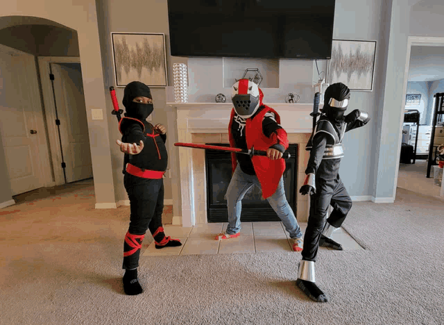 three children dressed up as ninjas and knights are standing in front of a fireplace in a living room