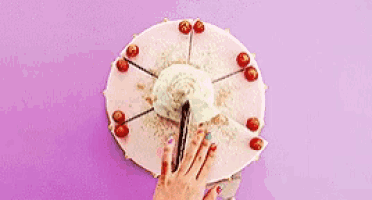 a person is cutting a piece of cake with a knife on a purple surface .