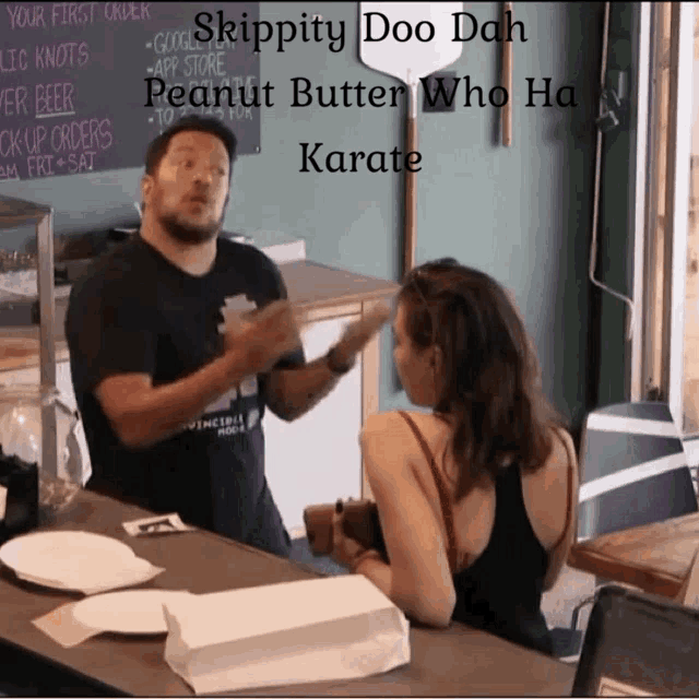 a man talking to a woman in front of a chalkboard that says skippity doo dah peanut butter who ha karate