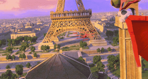 an aerial view of the eiffel tower with a cartoon character in front of it