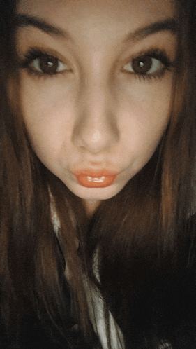 a close up of a woman 's face with her lips visible
