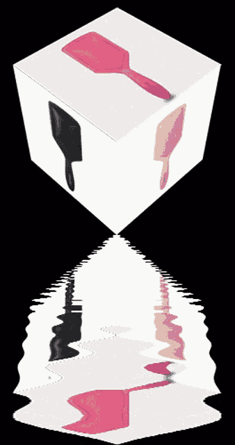 a cube with three different colored brushes on it