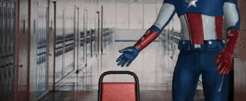 a man in a captain america costume is reaching for a chair