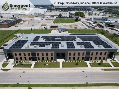 an aerial view of a large building with solar panels on it