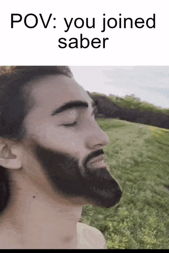 a man with a beard is standing in a field with his eyes closed and the words pov : you joined saber above him .