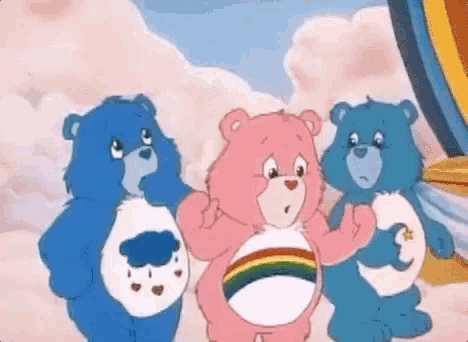 a group of care bears standing next to each other in the clouds .