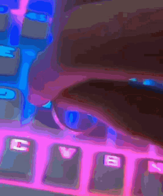 a close up of a person 's hand on a keyboard with the keys c v and b visible